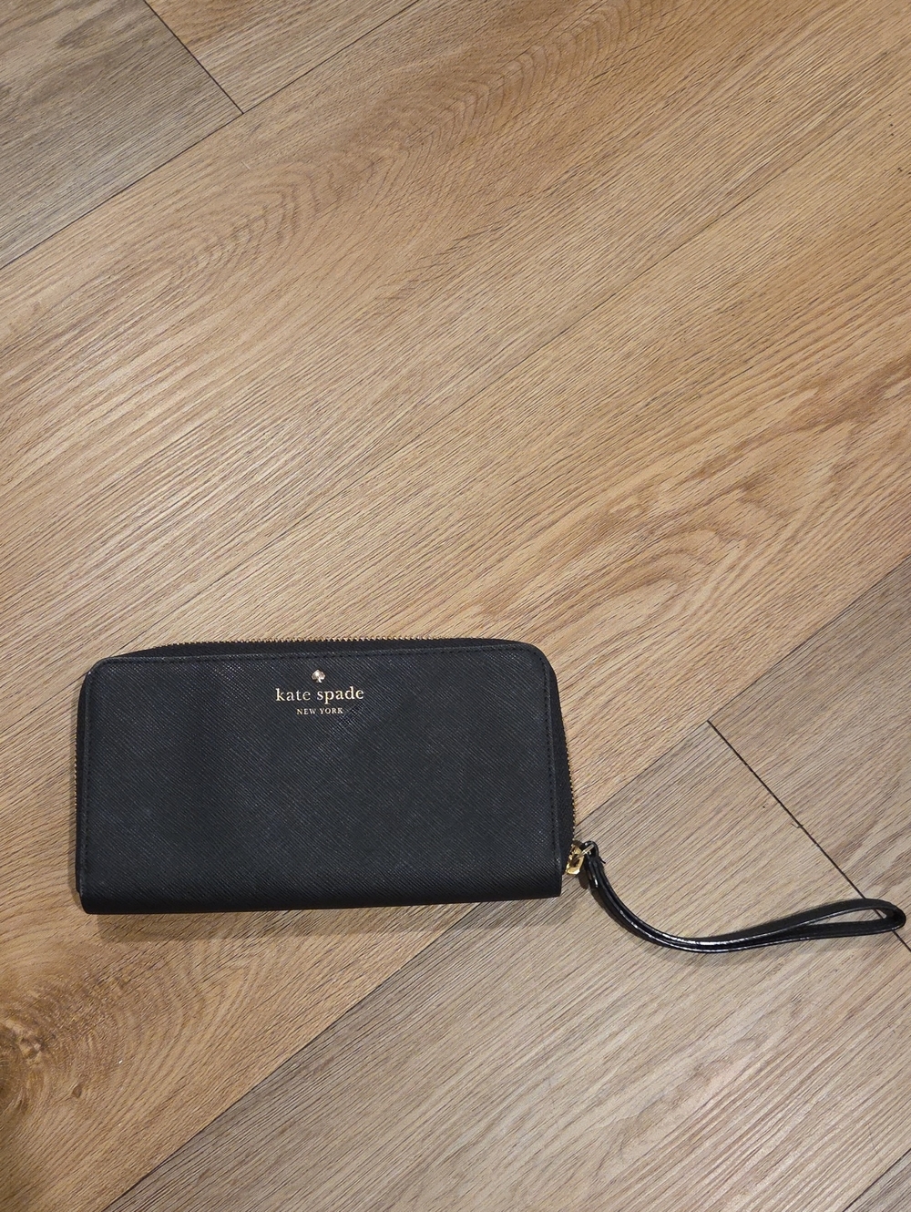 kate spade black zip-around wristlet wallet with gold logo